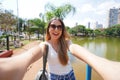 Portrait of happy Brazilian girl takes selfie in Vaca Brava Park in Goiania, Goias, Brazil Royalty Free Stock Photo