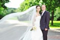 Portrait of happy bride and groom in a park Royalty Free Stock Photo