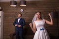 Portrait of happy bride and serious groom Royalty Free Stock Photo