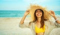 portrait happy bright summer woman with beautiful smile in big straw hat at beach