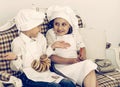 Portrait of happy brother and sister as a chef discussing recipe Royalty Free Stock Photo