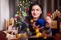 Portrait of brunette woman holding a blue gift box in hands Royalty Free Stock Photo