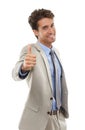 Portrait, happy business man or thumbs up in studio for winning deal, great success or agreement icon on white Royalty Free Stock Photo