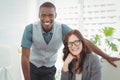 Portrait of happy business professionals at computer desk