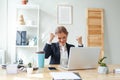 Portrait of happy business woman in office rejoicing success Royalty Free Stock Photo