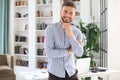 Portrait of happy businessman with arms crossed standing in office Royalty Free Stock Photo