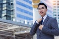 Portrait happy businessman in city Happy leadership business man get confident and determined He wear suit, necktie Handsome asian Royalty Free Stock Photo