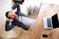 Happy businessman relaxing in office with laptop Royalty Free Stock Photo