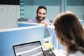 Portrait Of Happy Businessman Smiling At Camera In Coworking Office