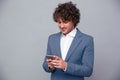 Portrait of a happy businessman using smartphone Royalty Free Stock Photo