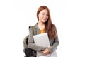 Portrait of happy casual Asian girl student with backpack and laptop isolated on white background. Back to school and learning Royalty Free Stock Photo