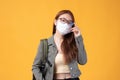 Portrait of happy casual Asian girl student wearing face mask to study with backpack back to school and learning concept isolated Royalty Free Stock Photo