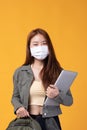 Portrait of happy casual Asian girl student wearing face mask to study with backpack and laptop back to school and learning Royalty Free Stock Photo