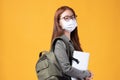 Portrait of happy casual Asian girl student wearing face mask to study with backpack and laptop back to school and learning Royalty Free Stock Photo