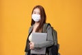 Portrait of happy casual Asian girl student wearing face mask to study with backpack and laptop back to school and learning Royalty Free Stock Photo