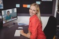 Portrait of happy caucasian female teacher using computer on video call with schoolboy