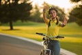Portrait of happy caucasian girl with bicycle outdoors. Royalty Free Stock Photo
