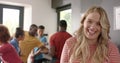 Portrait of happy caucasian woman preapring meal with diverse friends in kitchen, slow motion