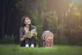 Portrait of happy charming  Asian woman reading Royalty Free Stock Photo