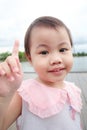 Portrait of happy charming 4 years old cute baby Asian girl, little preschooler child with toothy beaming smile looking to the Royalty Free Stock Photo