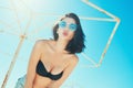 Portrait of happy cheerful emotional young woman in trendy glasses blowing kiss enjoying summer on the beach. Holidays Vacation Royalty Free Stock Photo