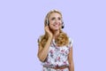Portrait of happy cheerful female customer support operator wearing headset. Royalty Free Stock Photo