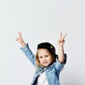 Portrait of a happy cheerful girl in summer hat showing peace gesture with two hands Royalty Free Stock Photo