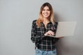 Portrait of a happy cheerful girl using laptop computer Royalty Free Stock Photo