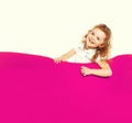 Portrait of happy cheerful laughing little girl child on pink armchair, blank copy space for advertising text Royalty Free Stock Photo