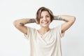 Portrait of happy cheerful pretty tattooed girl smiling looking at camera over white background. Royalty Free Stock Photo