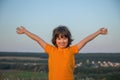 Portrait of happy cheerful smiling boy on the meadow in spring d Royalty Free Stock Photo