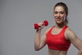 Portrait of Happy cheerful woman lifting dumbbell Royalty Free Stock Photo