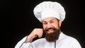 Portrait of a happy chef cook. Cook hat. Bearded chef, cooks or baker. Bearded male chefs isolated on black. Funny chef Royalty Free Stock Photo