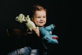 Portrait of a happy child boy playing with dinosaur toys Royalty Free Stock Photo