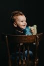 Portrait of a happy child boy playing with dinosaur toys Royalty Free Stock Photo