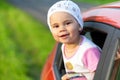 Portrait of happy child girl sticking their head out the car win Royalty Free Stock Photo