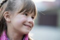 Portrait of happy child girl in warm clothes in autumn outdoors Royalty Free Stock Photo