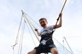 Happy child jumping on bungee trampoline Royalty Free Stock Photo