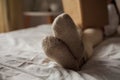 Portrait of happy child. Little beautiful curly girl is reading book in her bed. Cozy house Royalty Free Stock Photo