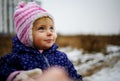 Portrait Of Happy Child Looking Up The Sky In Winter Hat. Funny Happy Cute Little Girl With Blue Eyes Outdoor. Royalty Free Stock Photo