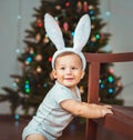 Portrait of a happy child near a Christmas tree