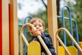 Portrait of happy child outdoors. Cute boy playing on playground. Royalty Free Stock Photo