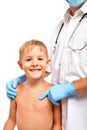 Portrait of a happy child standing next to a doctor