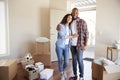 Portrait Of Happy Couple With Boxes In New Home On Moving Day Royalty Free Stock Photo