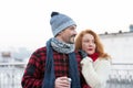 Portrait of happy couple with coffee cup. Couple has date on city street. Loving couple looking to right way. Royalty Free Stock Photo