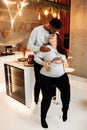 Portrait of happy couple cuddling, loving African American man kiss pregnant beautiful woman, caring husband with lovely Royalty Free Stock Photo