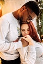 Portrait of happy couple cuddling, loving African American man hold a hand of pregnant beautiful woman, caring husband Royalty Free Stock Photo