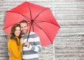 Portrait of happy couple holding umbrella Royalty Free Stock Photo