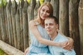 Portrait of Happy Couple Hugging Laughing Wooden Background