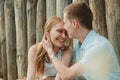 Portrait of Happy Couple Hugging Laughing Wooden Background